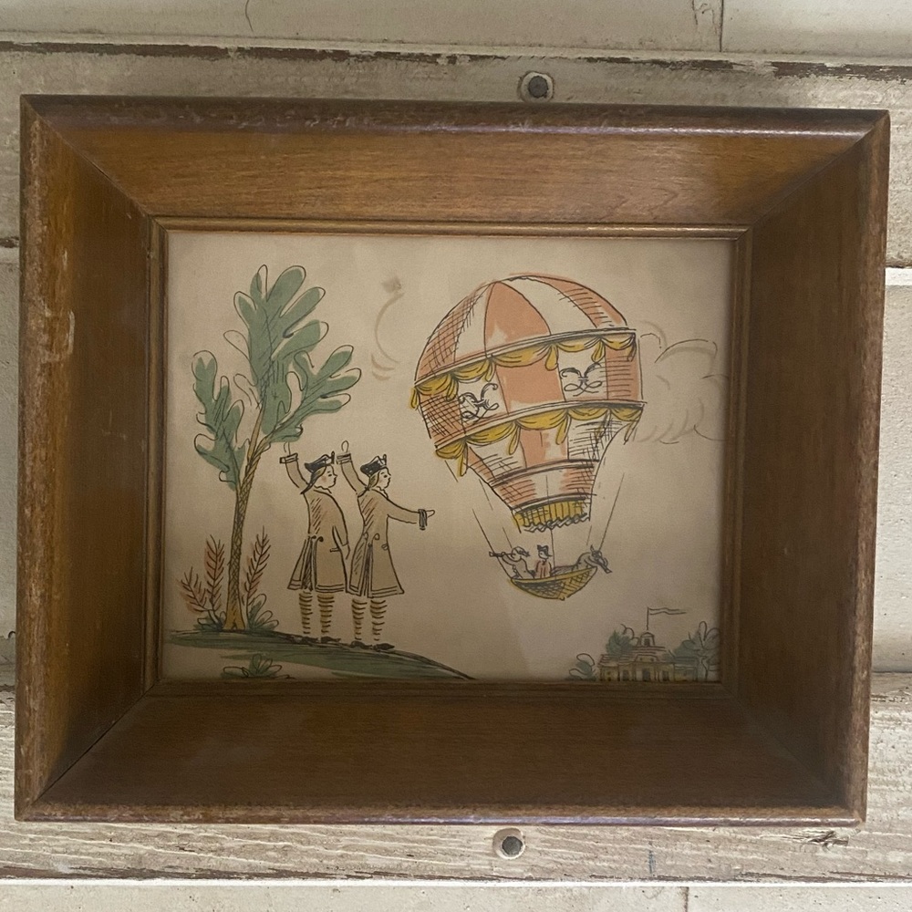 Beautiful small framed artwork with air balloon and figures